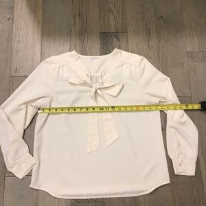 Cream tie-front long sleeve blouse